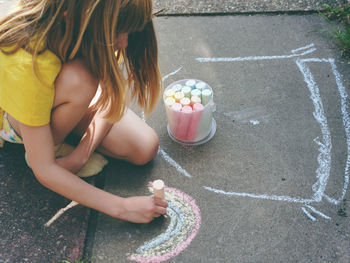 High angle view of girl playing on street