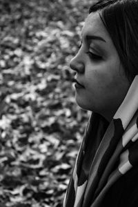 Close-up portrait of a young woman looking away