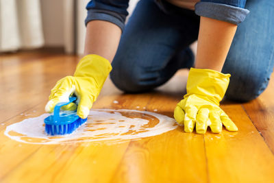 Low section of woman painting on table