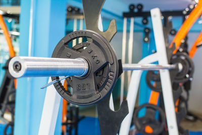 Close-up of barbell in gym