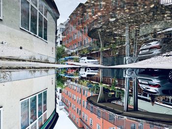 High angle view of canal by buildings in city