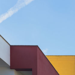 Low angle view of building against blue sky