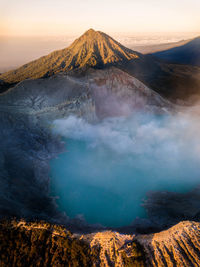 Smoke emitting from volcanic mountain