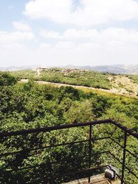 Scenic view of landscape against cloudy sky