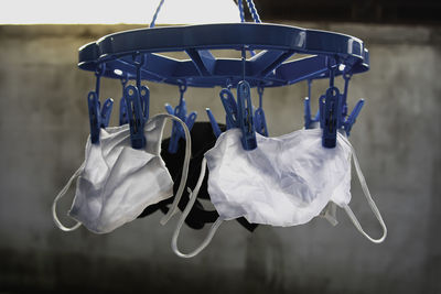 Drying mask hanging under the sun after use for disinfecting. cotton cloth mask hanging outdoor.