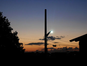 Low angle view of silhouette trees at sunset