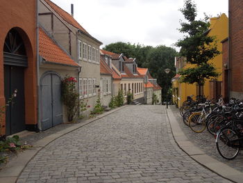 Street amidst buildings against sky
