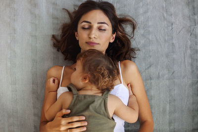 High angle view of mother and daughter at home