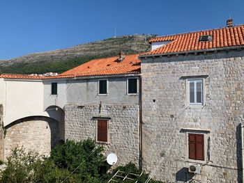 Houses against sky in town