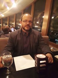 Mid adult man sitting in restaurant