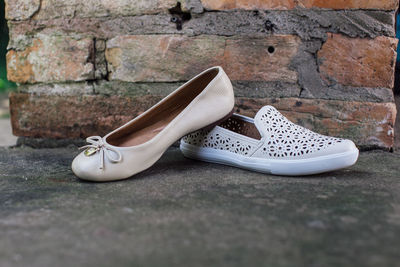 Close-up of shoes on wall