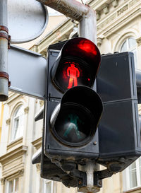 Close-up low angle view of red light at pedestrian crossing. traffic light, don't walk, stop.