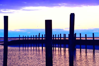 Pier over sea against sky