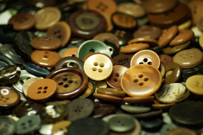 High angle view of buttons on table