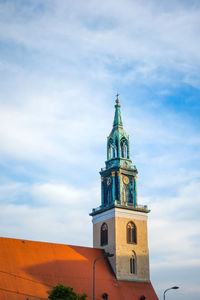 Low angle view of st mary church against cloudy sky