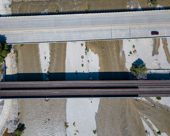 High angle view of railroad tracks by wall