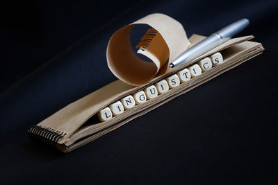 High angle view of pencil on table against black background