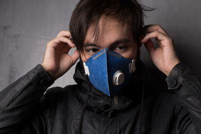 Man wearing pollution mask