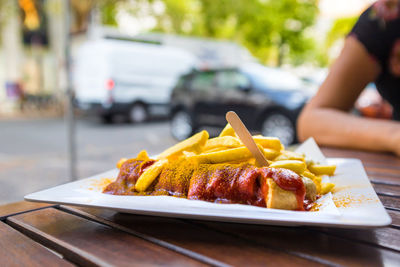 Close-up of man preparing food on table