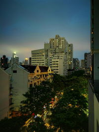 Buildings in city against sky