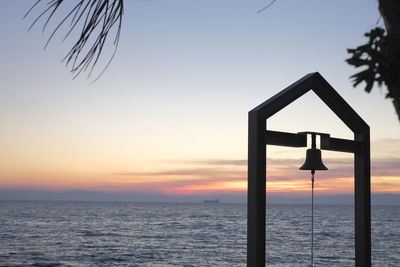 Scenic view of sea against clear sky during sunset