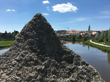 Panoramic view of old buildings and city against sky