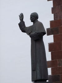 Low angle view of statue against sky