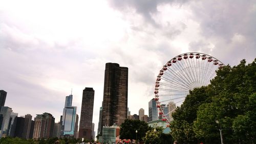 Low angle view of ferris wheel against sky