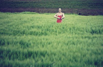 Mannequin standing on grassland