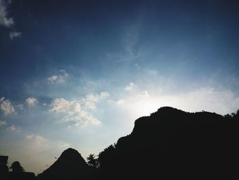 Low angle view of silhouette mountain against sky