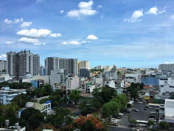 High angle view of buildings in city against sky