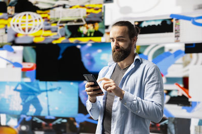 Portrait of man using mobile phone
