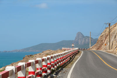 Panoramic view of road by sea against clear sky