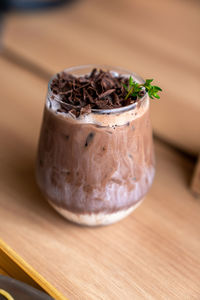 High angle view of coco drink in glass on table