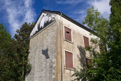 Low angle view of old building against sky