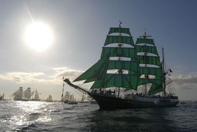 Ship sailing on sea against sky