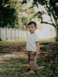 Portrait of cute boy on field