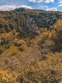 High angle view of trees and buildings against sky