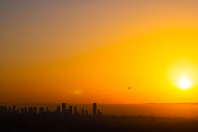 Silhouette of birds at sunset