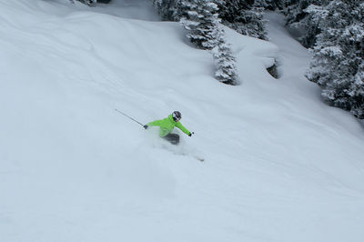 Person skiing on snow covered land