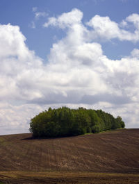 Scenic view of landscape against cloudy sky