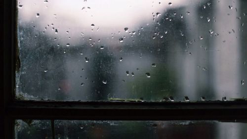 Close-up of water drops on glass window