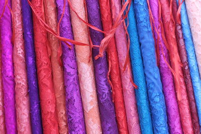 Full frame shot of multi colored umbrellas hanging at market stall