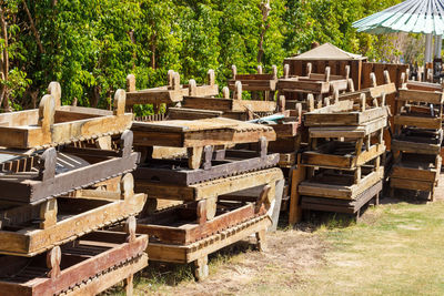 Discarded old wooden sunbeds. vintage sun loungers for recycling.