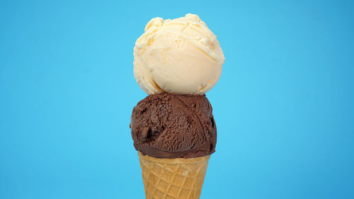 Close-up of ice cream against blue sky