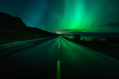 Road against sky at night