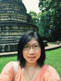 Portrait of beautiful young woman in park