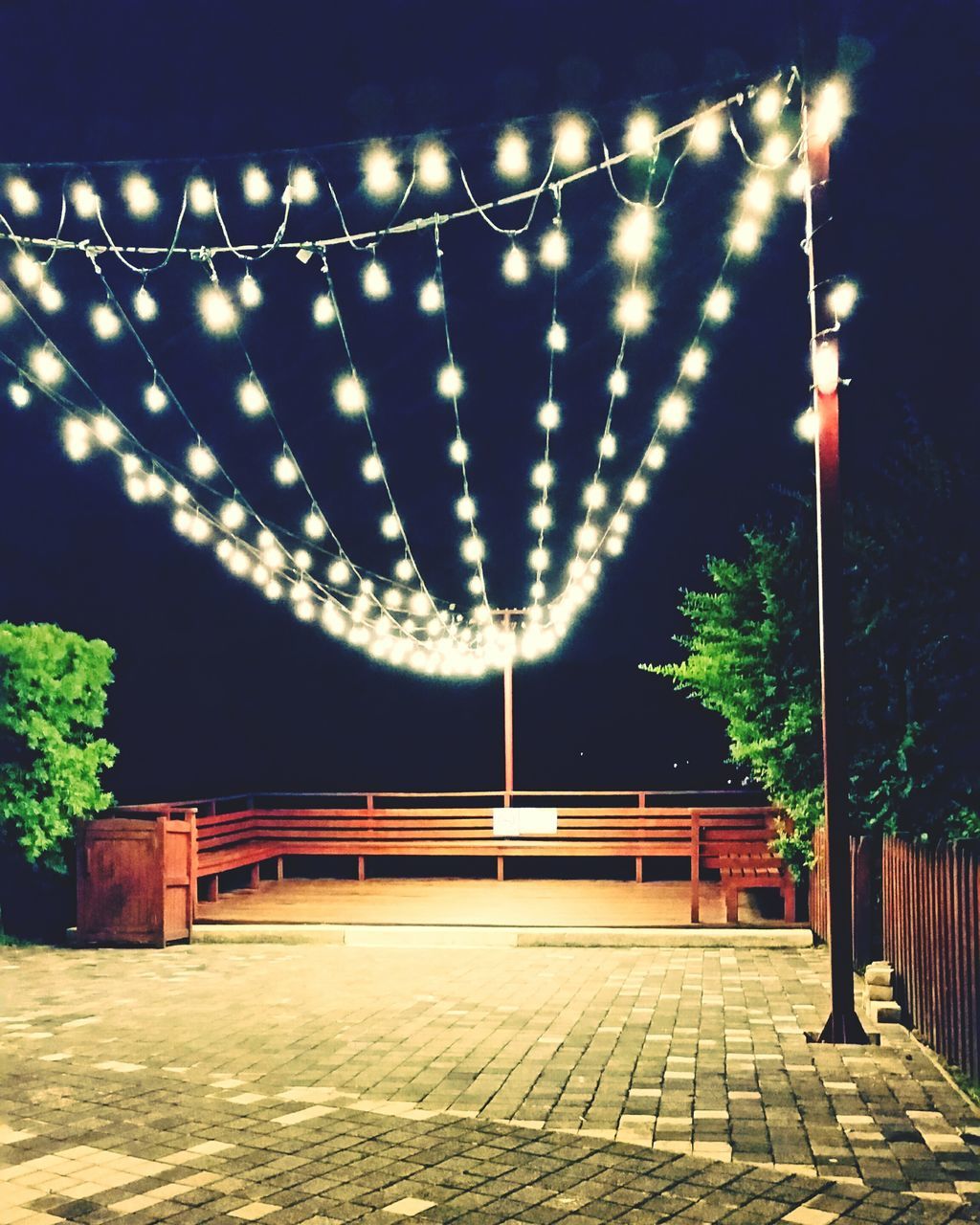 ILLUMINATED STREET LIGHTS AT NIGHT