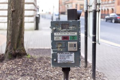 Close-up of information sign on footpath