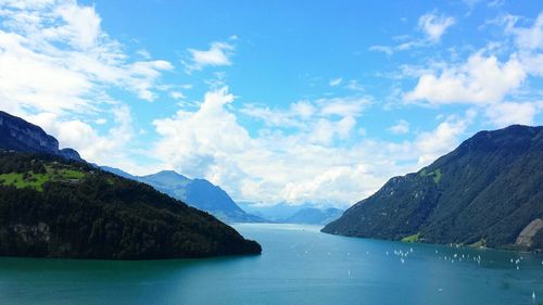 Scenic view of mountains against cloudy sky